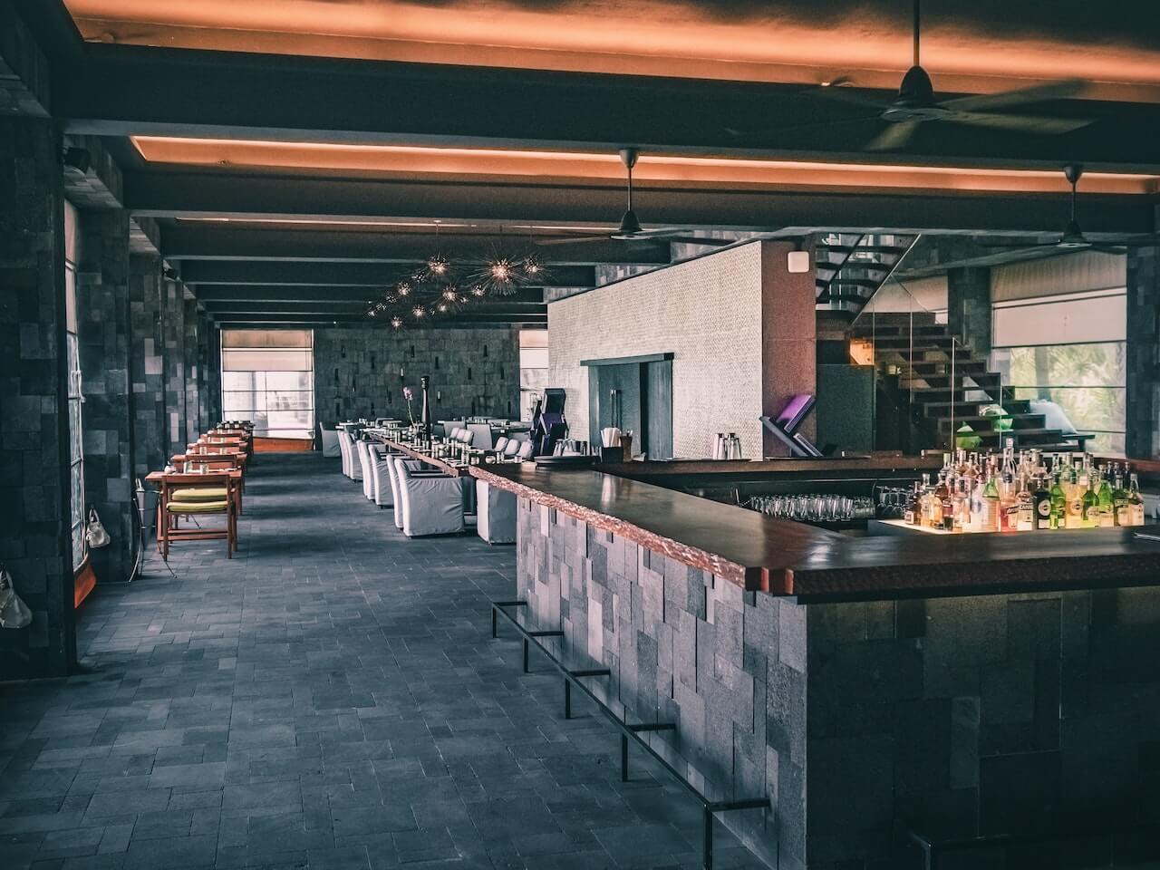 a bar with bottles on the counter